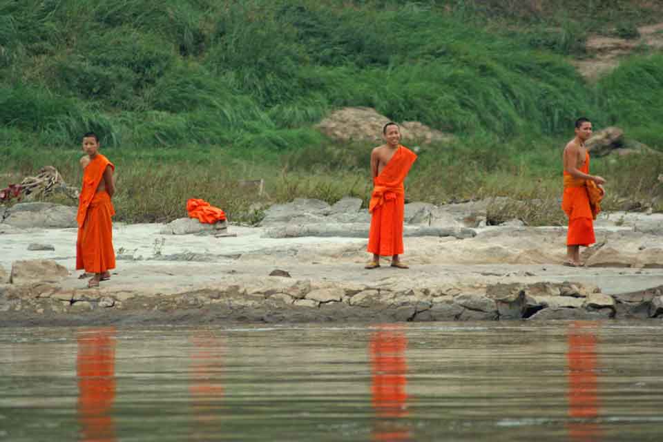 Spiritual enchantment: Buddhist Monks beside the Mekong